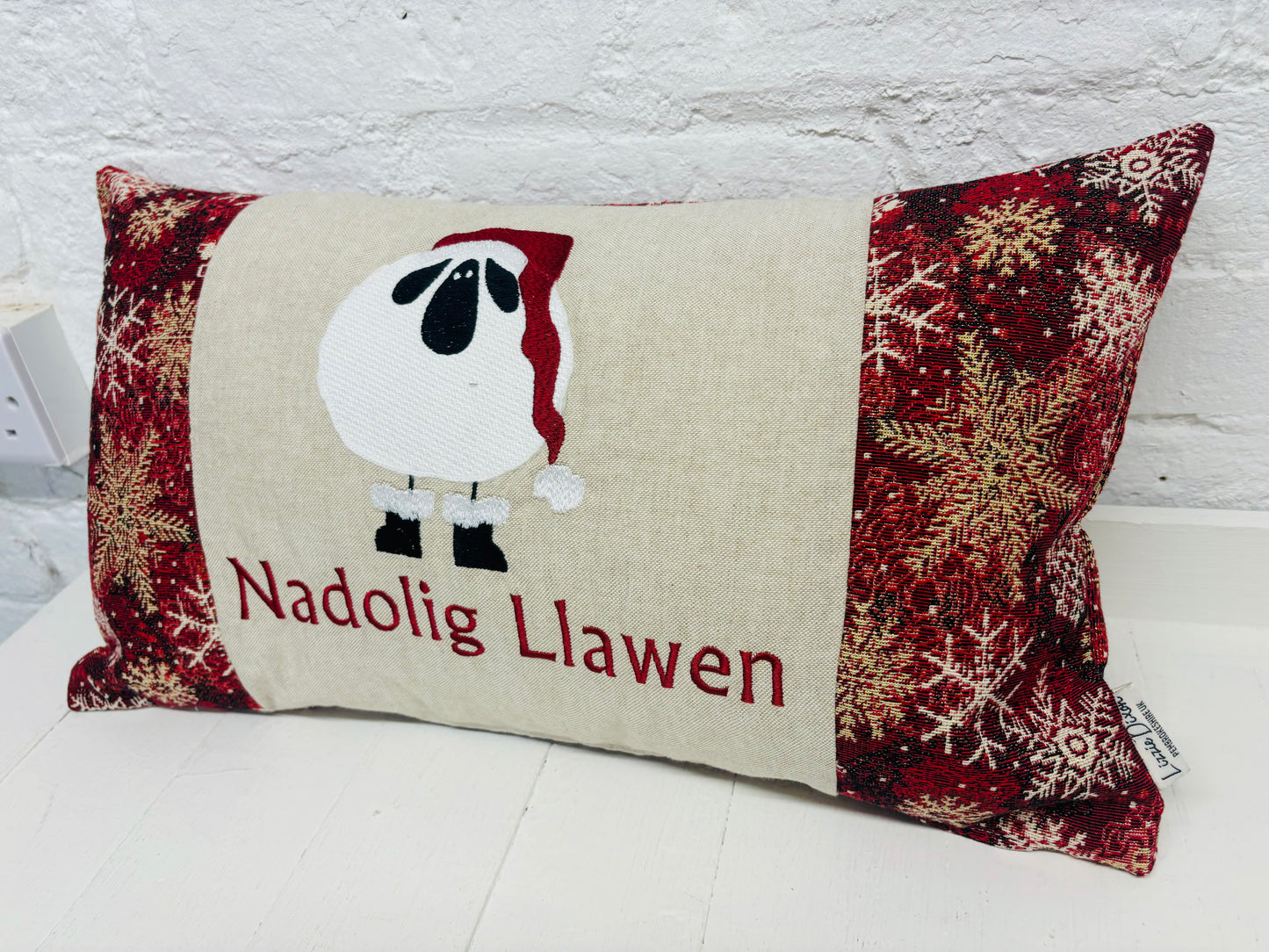 Festive Sheep Long Nadolig Llawen-Merry Christmas. Snow Flake Fabric