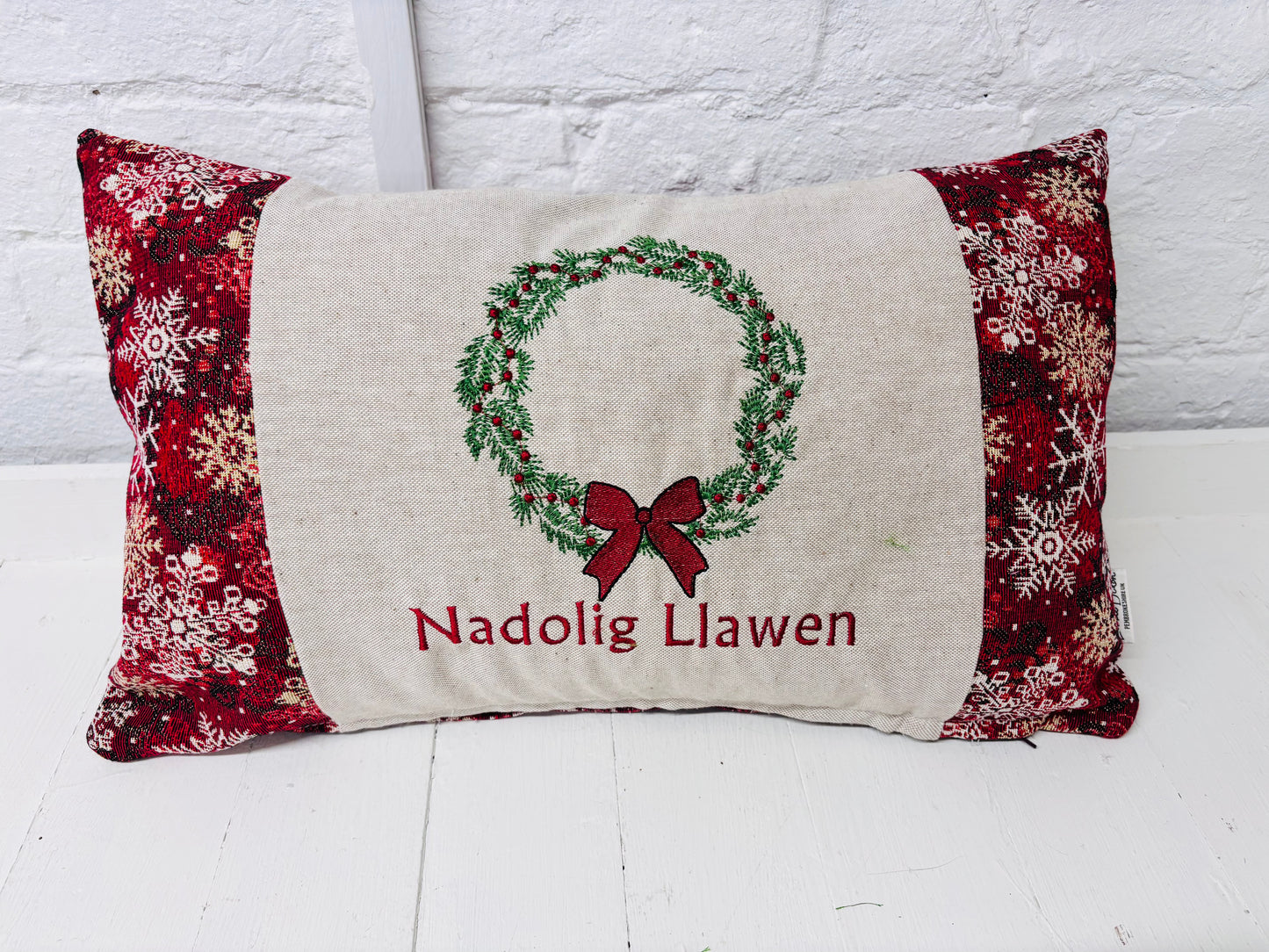 Christmas Wteath Nadolig llawen luxe Red and Gold Snowflake Cushion .
