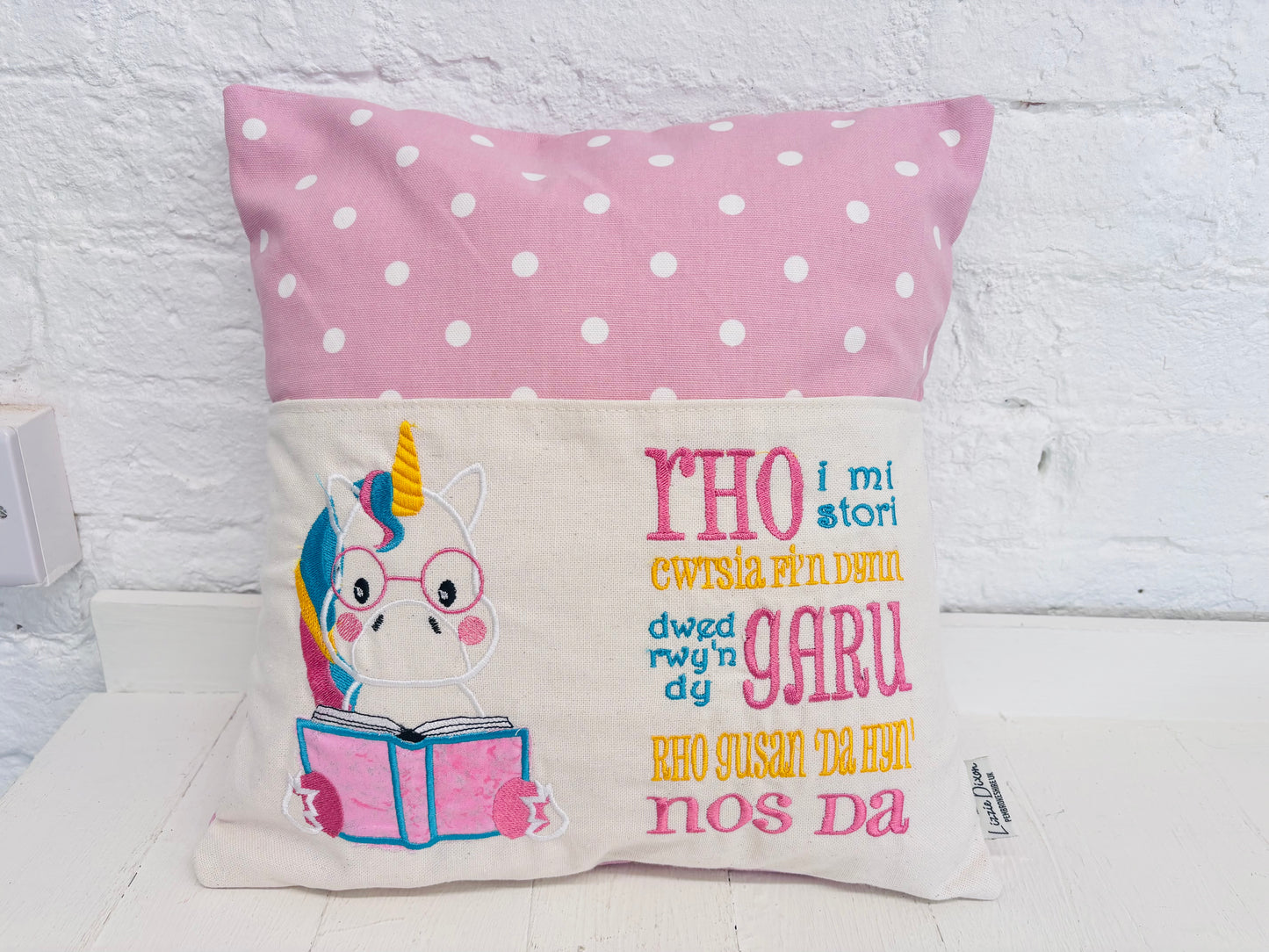 Unicorn with Pink Dotty Reading Book Cushion-English and Welsh saying