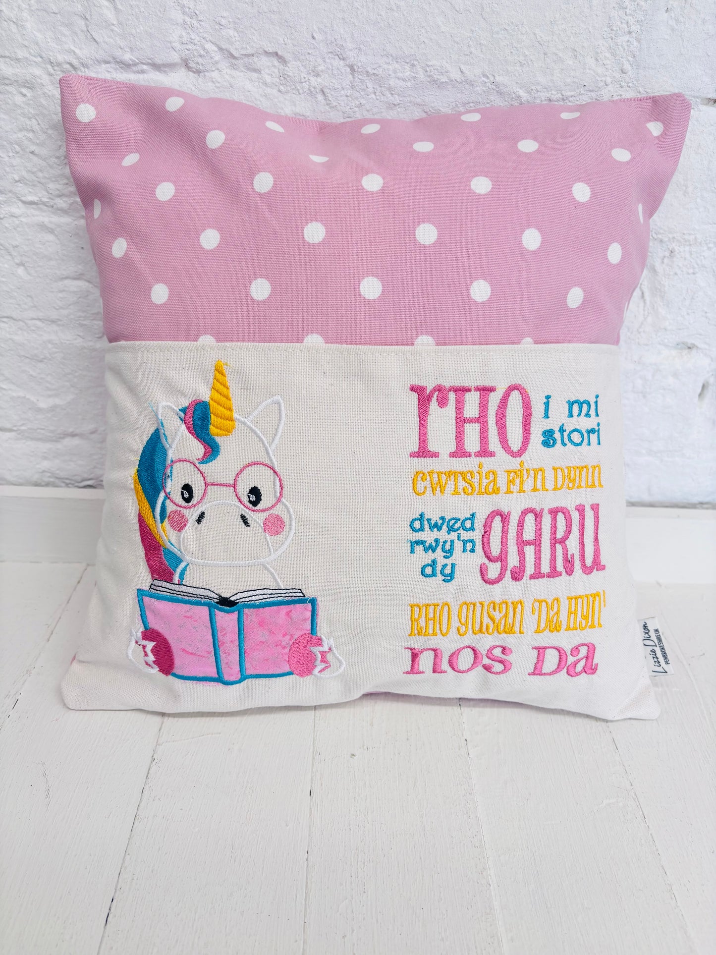 Unicorn with Pink Dotty Reading Book Cushion-English and Welsh saying