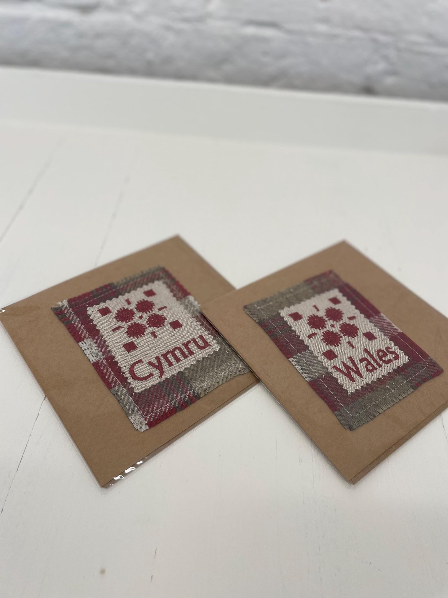Handmade Card with machine embroidered Welsh blanket design on Red Wool Touch fabric square mounted on a Kraft card with envelope