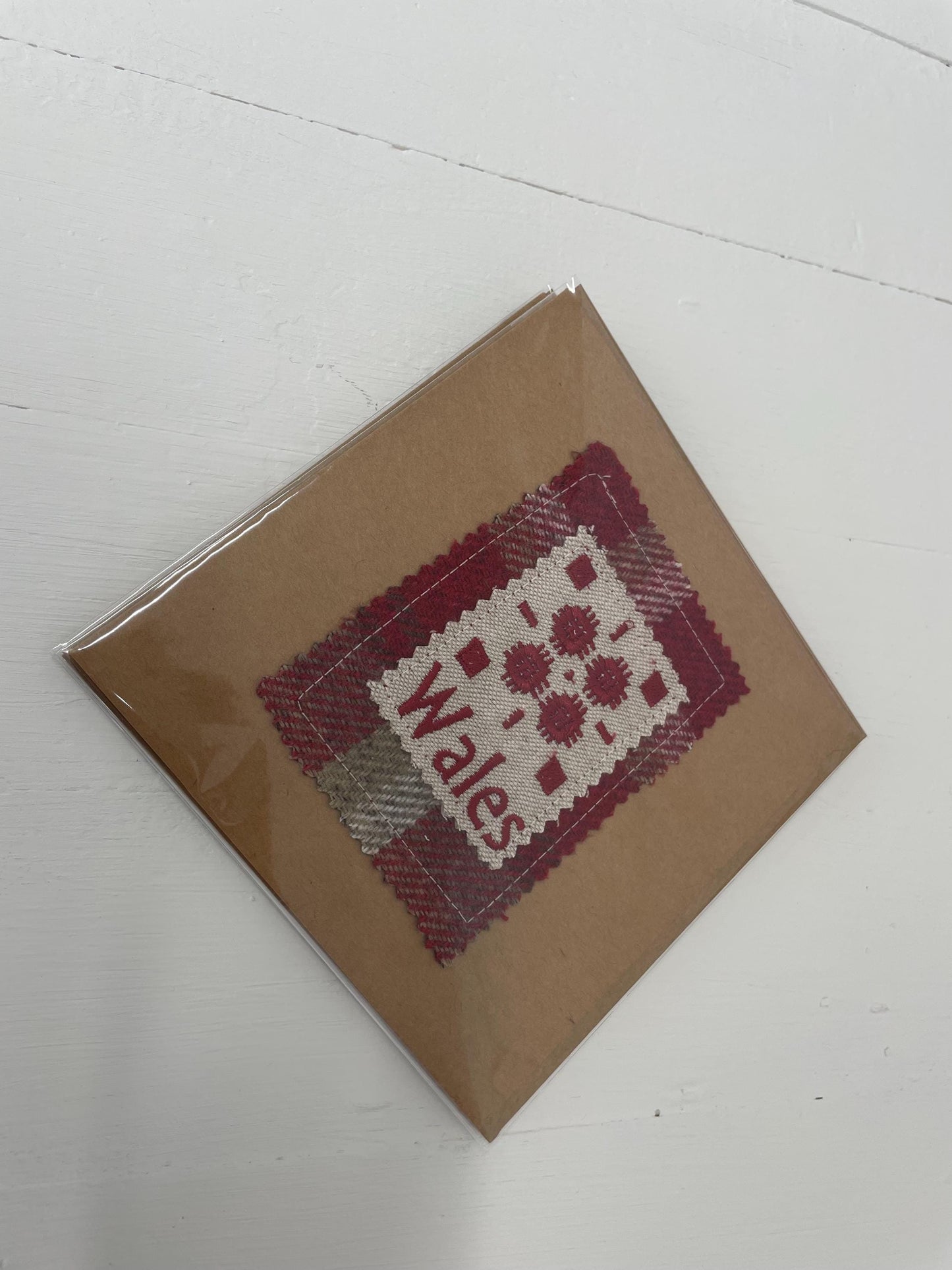 Handmade Card with machine embroidered Welsh blanket design on Red Wool Touch fabric square mounted on a Kraft card with envelope