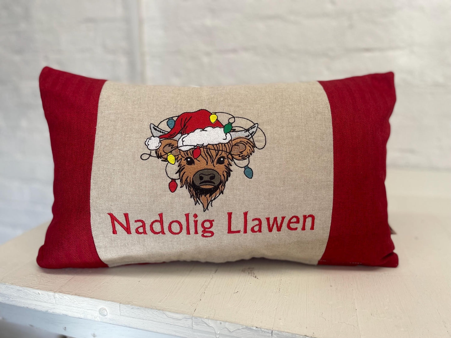 Festive Highland Cow with slights - Nadolig Llawen-Merry Christmas. Red Tweed Fabric