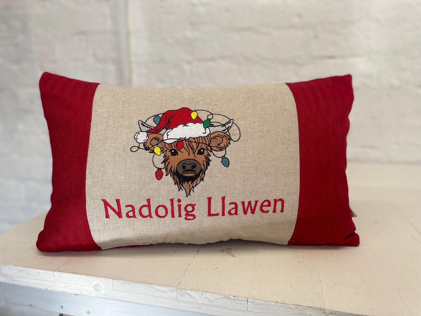 Festive Highland Cow with slights - Nadolig Llawen-Merry Christmas. Red Tweed Fabric