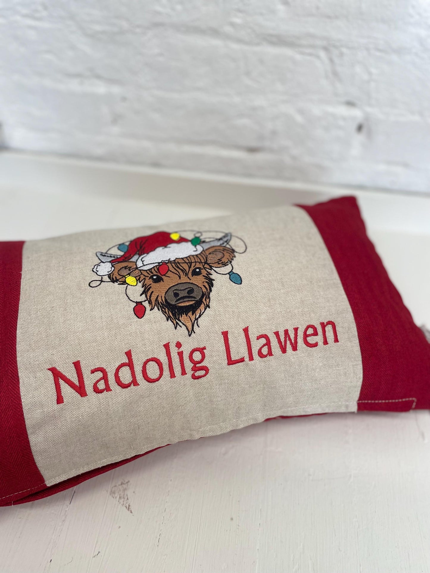 Festive Highland Cow with slights - Nadolig Llawen-Merry Christmas. Red Tweed Fabric