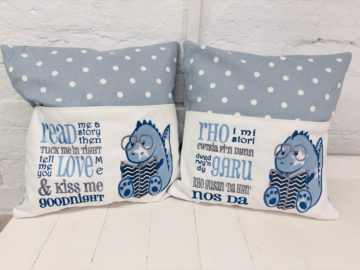 Blue Dino children’s Book Cushion available in Welsh or English.