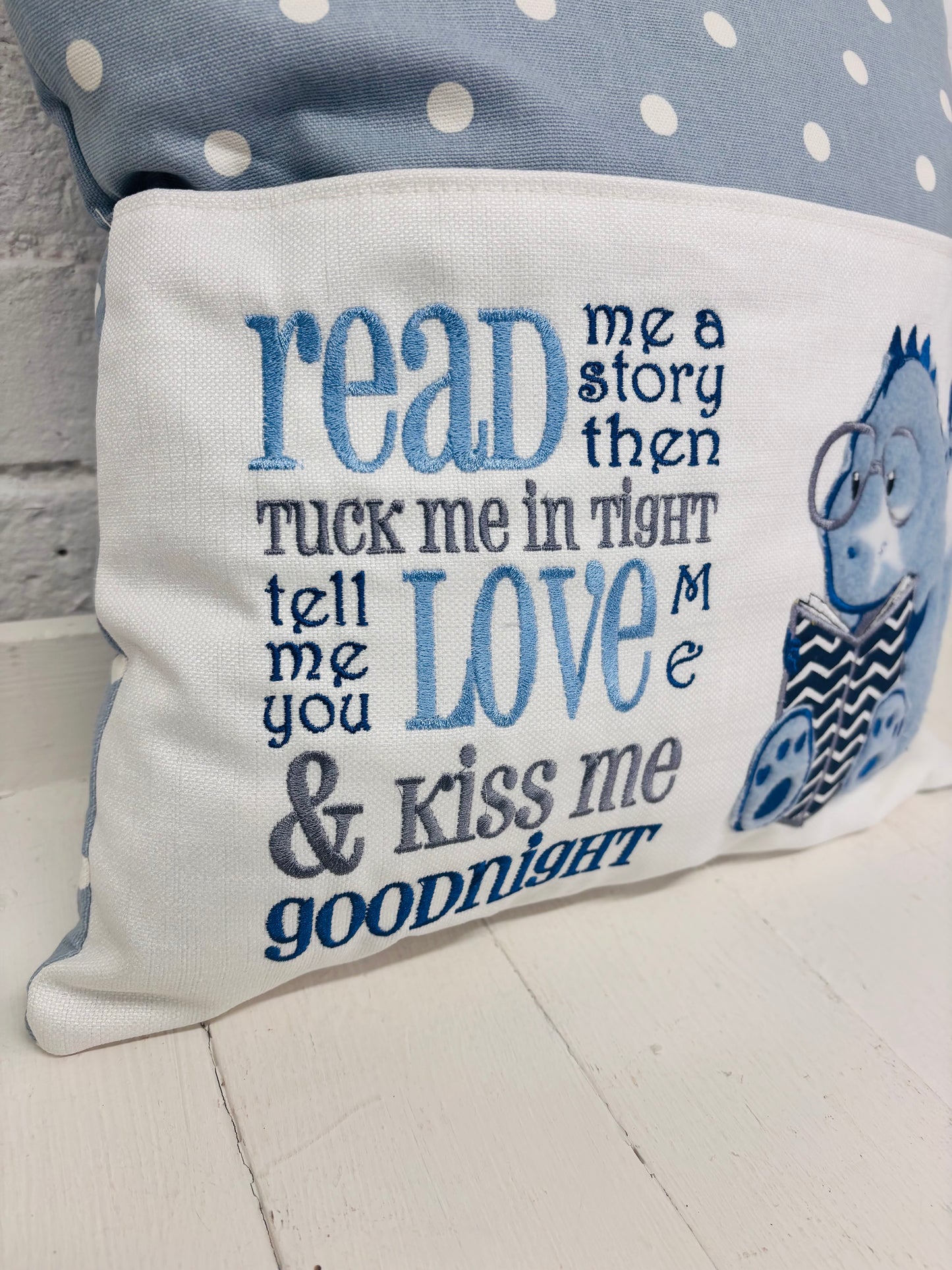 Blue Dino children’s Book Cushion available in Welsh or English.