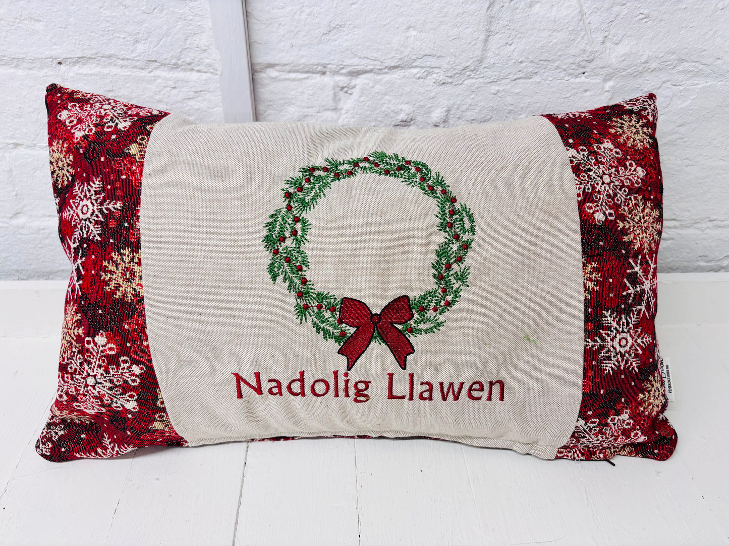 Christmas Wteath Nadolig llawen luxe Red and Gold Snowflake Cushion .