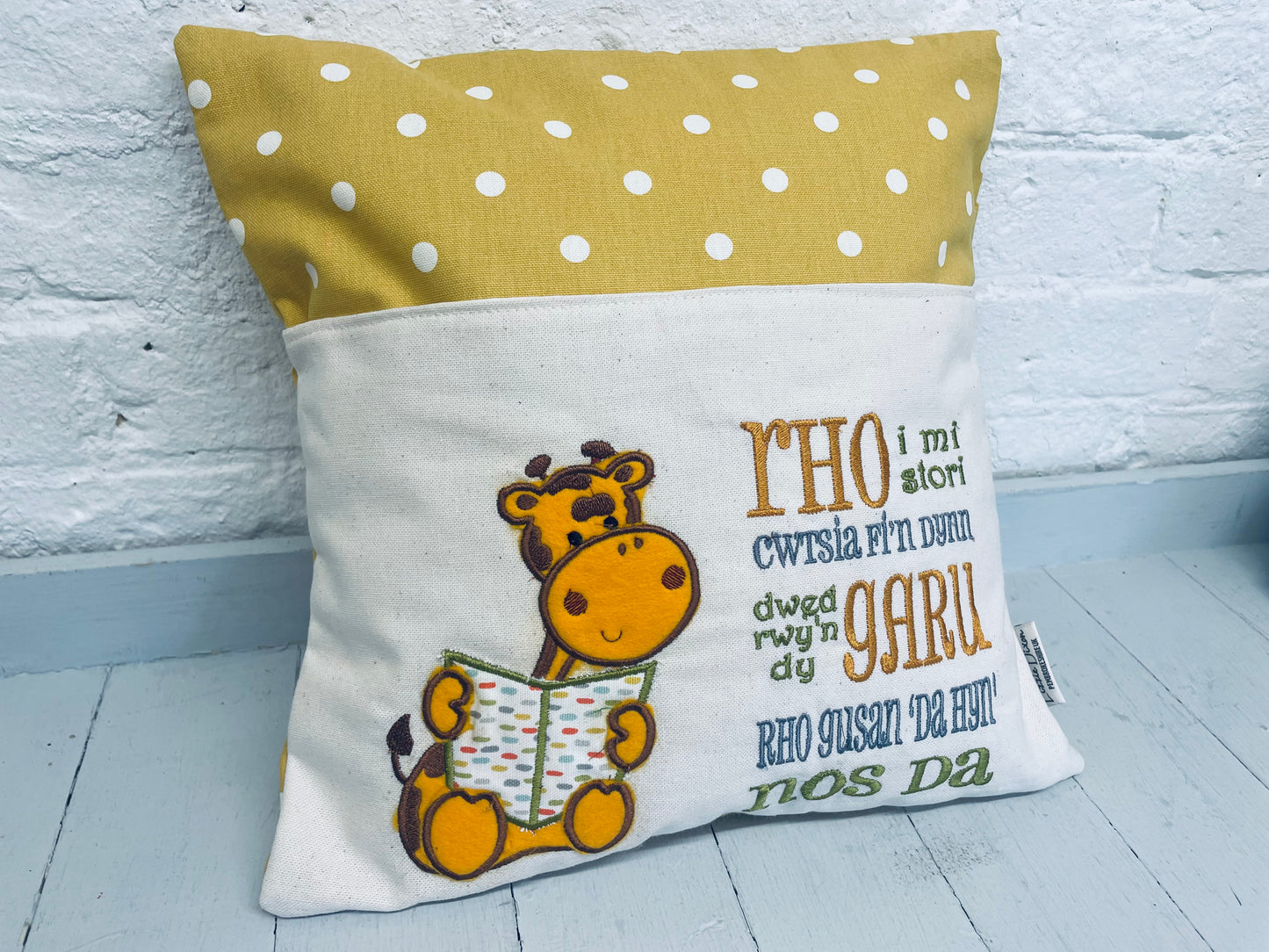 Giraffe with a welsh saying Children's Reading book Cushion.