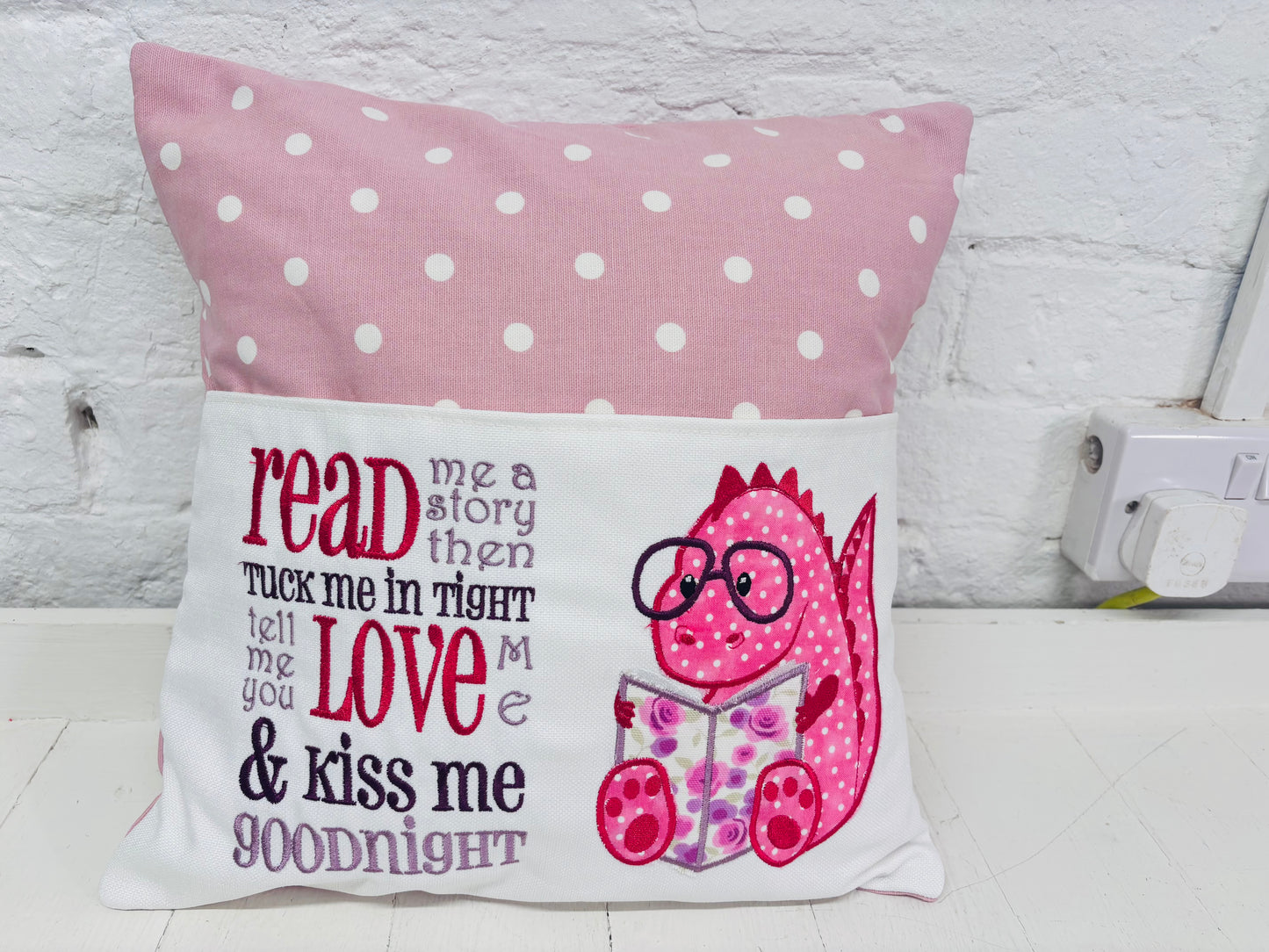 Pink Dino Children's Reading Book Cushion. available in Welsh and English