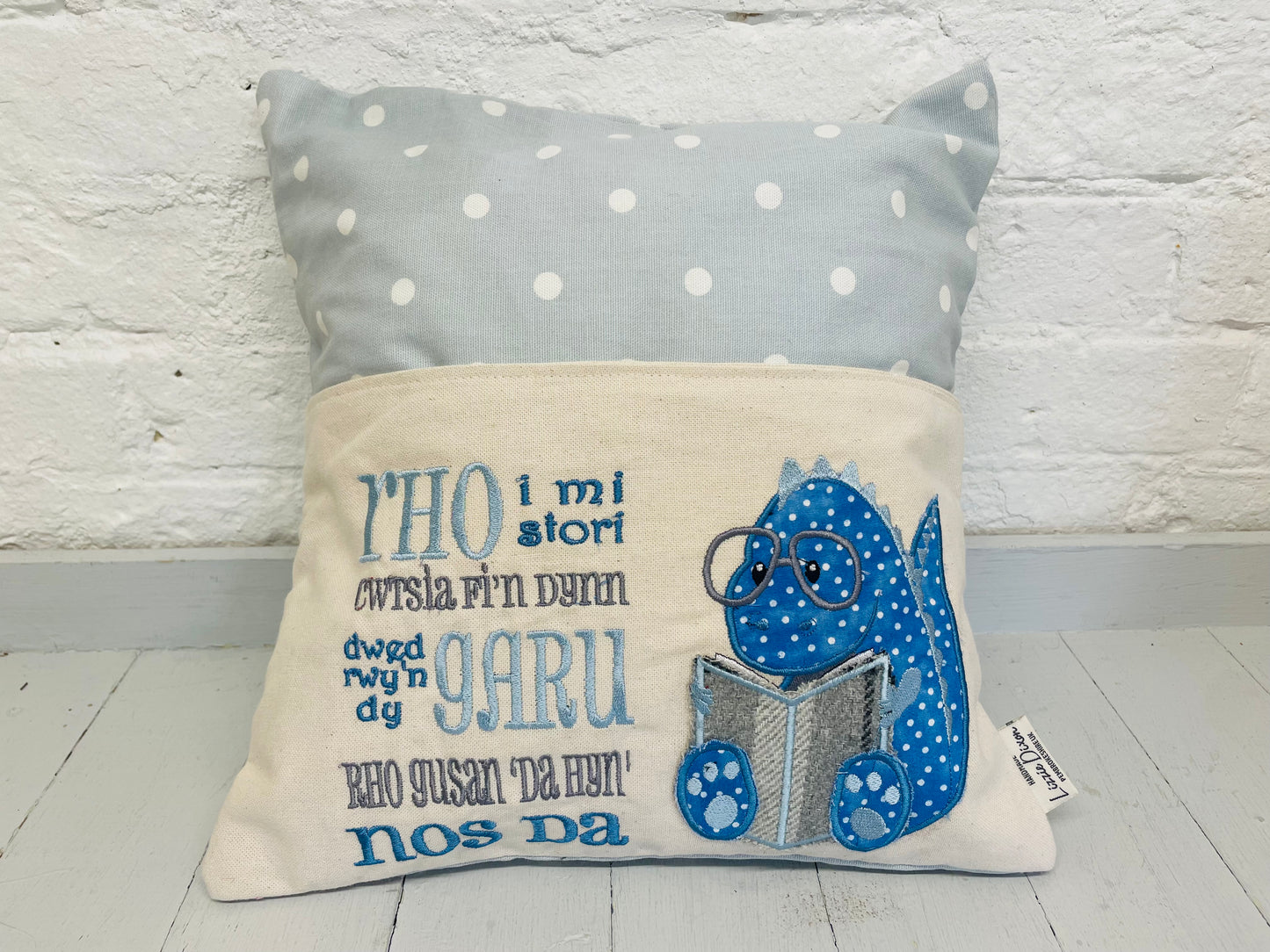 Welsh Blue Dino Children's Welsh Reading Book Cushion.