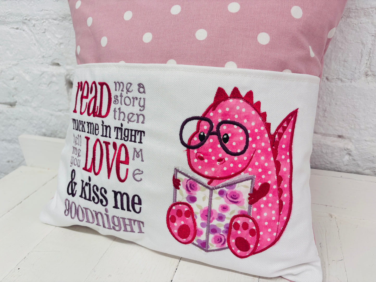 Pink Dino Children's Reading Book Cushion. available in Welsh and English