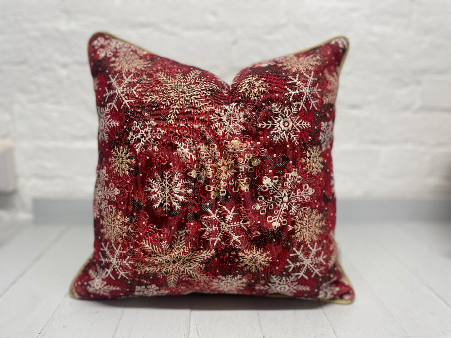 Snowflake Cushion with gold piping.