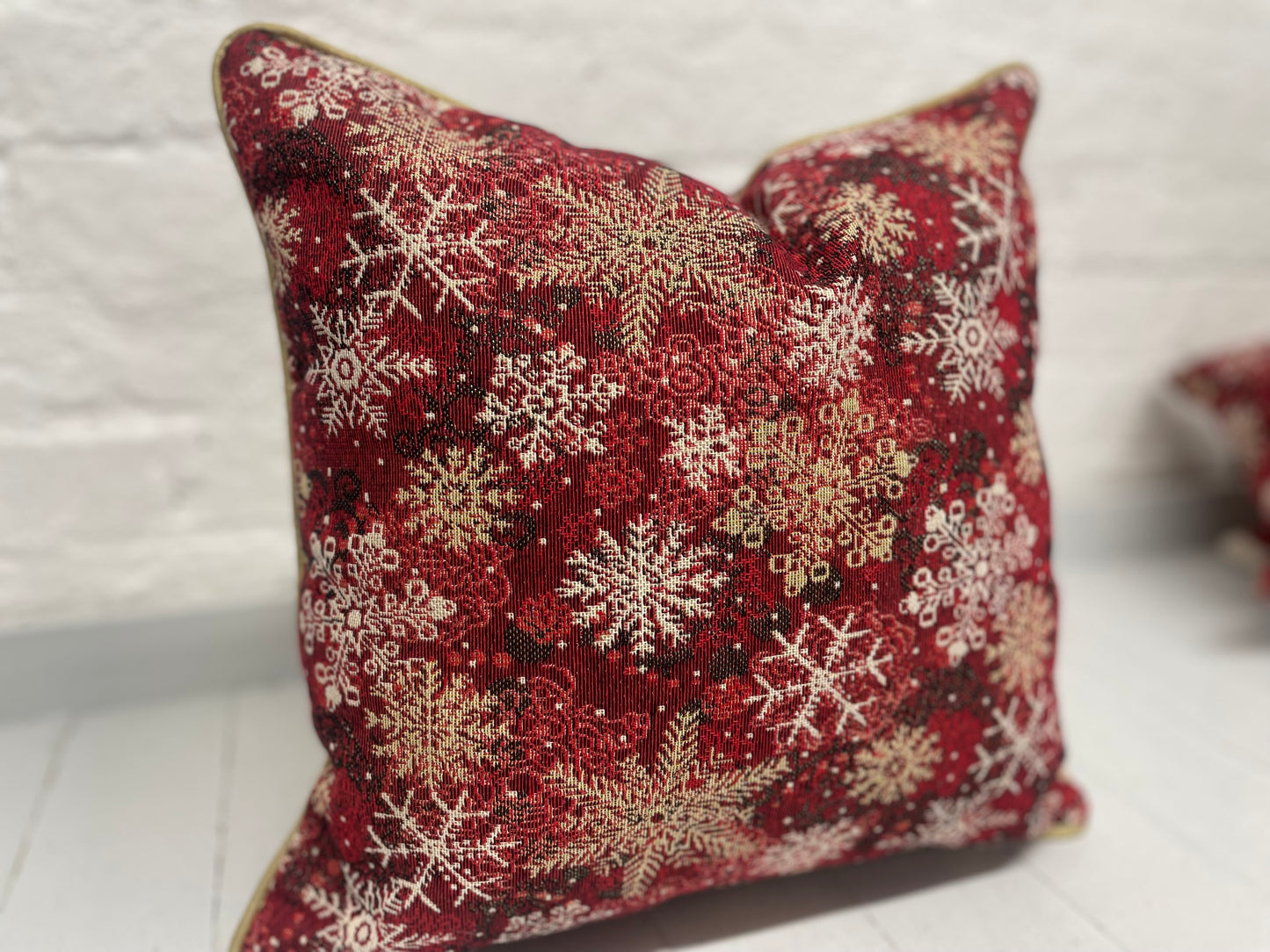Snowflake Cushion with gold piping.