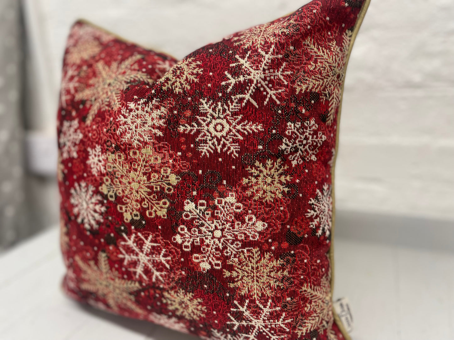 Snowflake Cushion with gold piping.