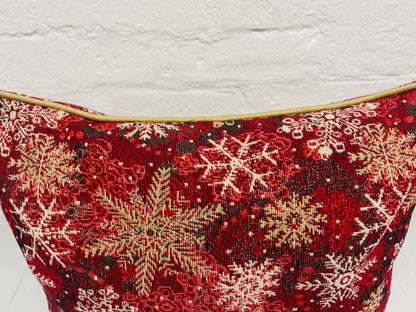 Snowflake Cushion with gold piping.