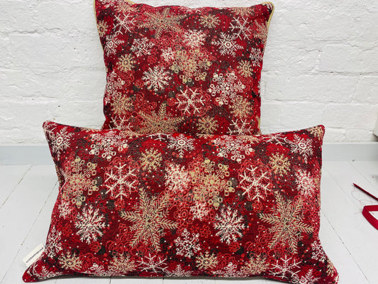 Snowflake Cushion with gold piping.