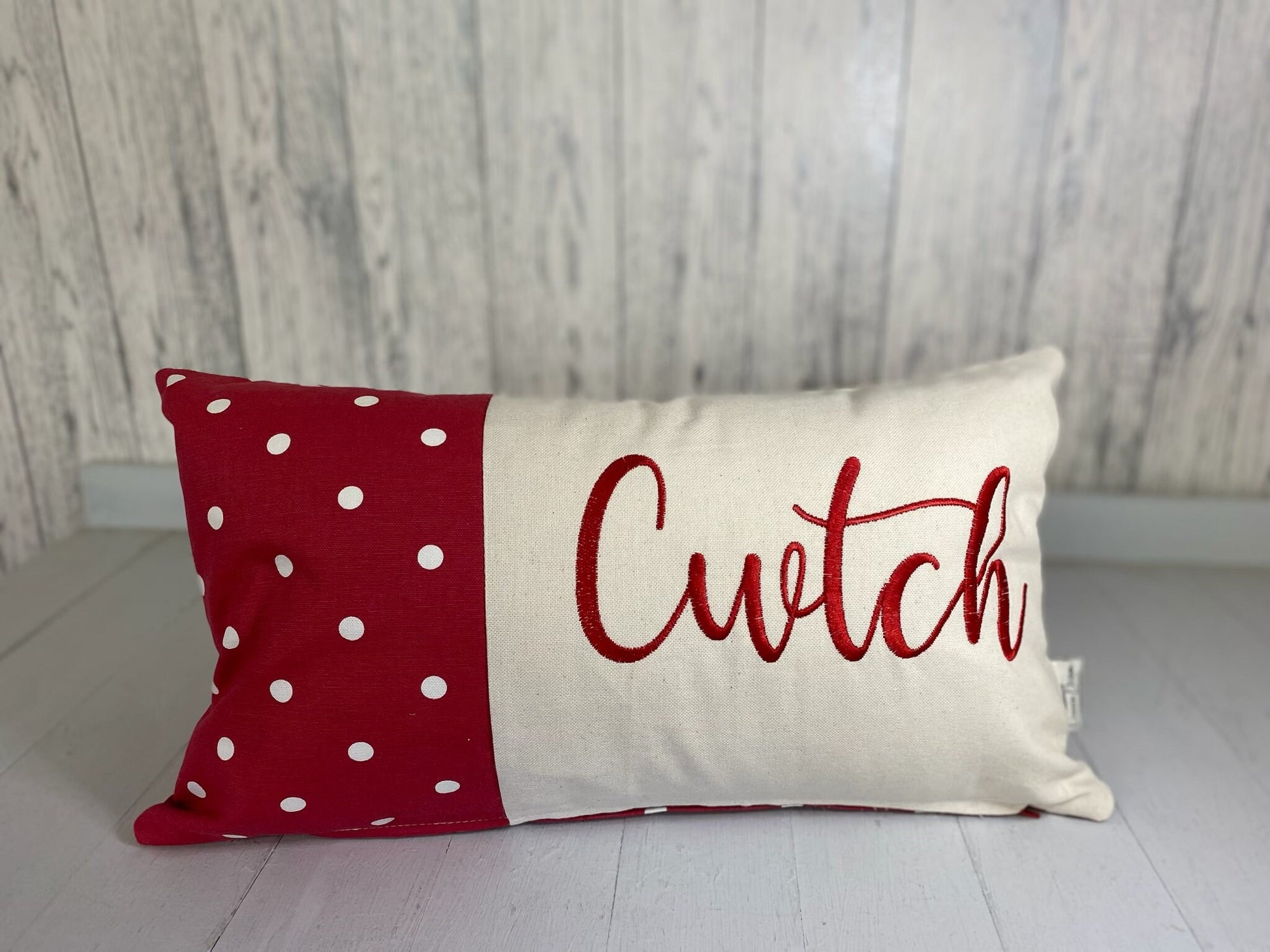 Cwtch Cushion-Personalised Cushion-Quote Cushion pretty Red dotty & Cream long cushion.