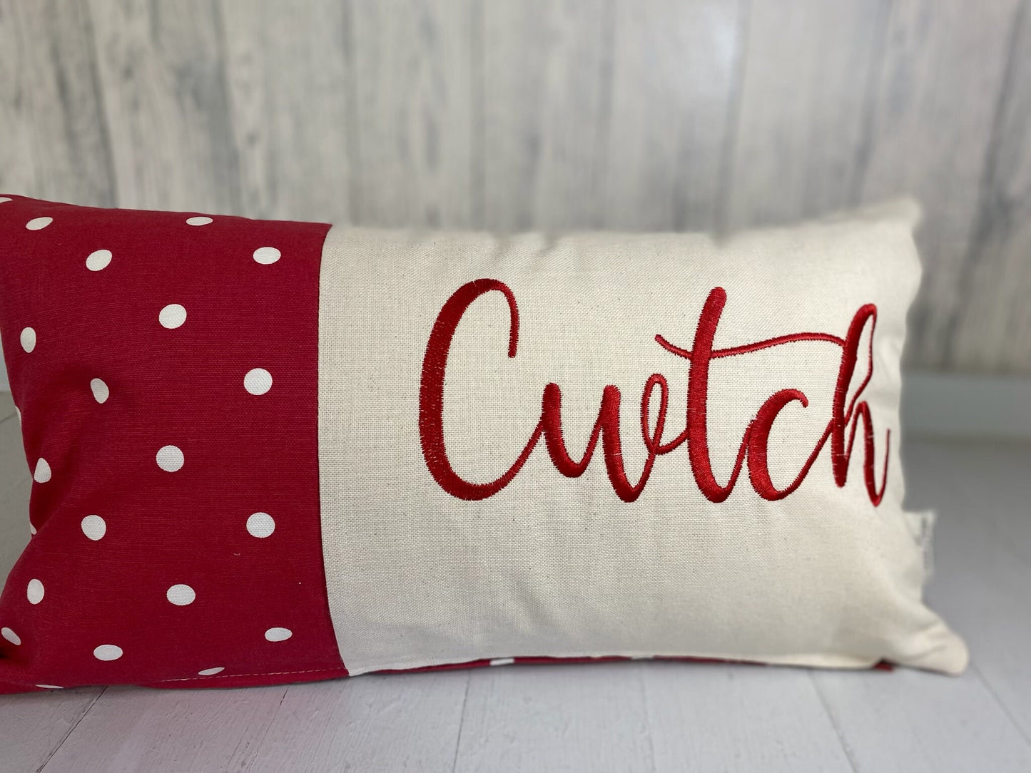 Cwtch Cushion-Personalised Cushion-Quote Cushion pretty Red dotty & Cream long cushion.