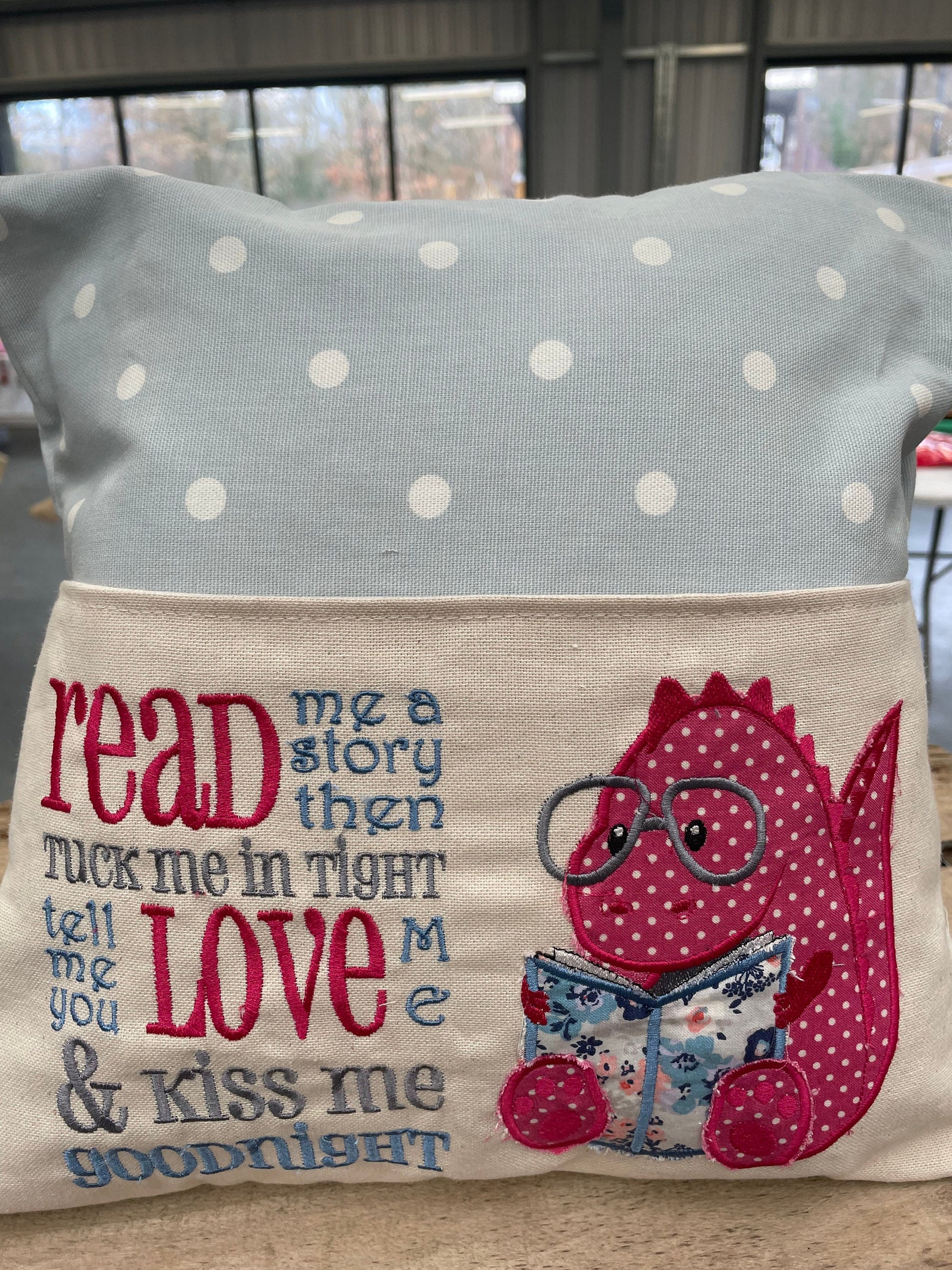 Blue and Pink Dino Children&#39;s Reading Book Cushion.