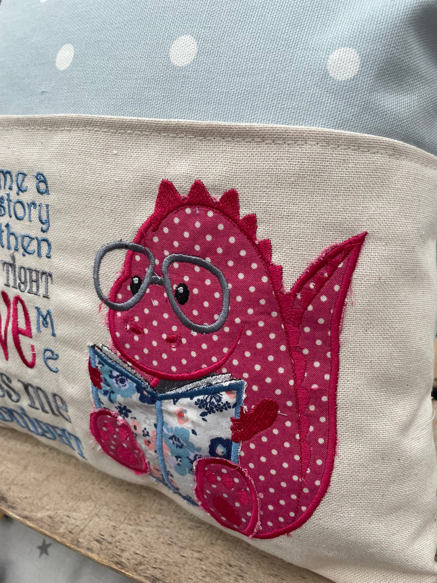 Blue and Pink Dino Children&#39;s Reading Book Cushion.