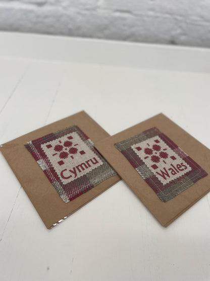 Handmade Card with machine embroidered Welsh blanket design on Red Wool Touch fabric square mounted on a Kraft card with envelope