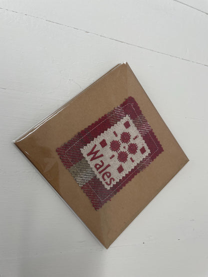 Handmade Card with machine embroidered Welsh blanket design on Red Wool Touch fabric square mounted on a Kraft card with envelope