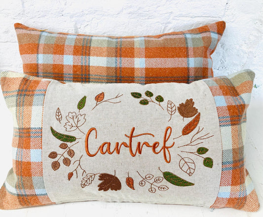 Orange Tartan Cushion with Cartref(Welsh for Home) panel adorned with embroidered leaves.