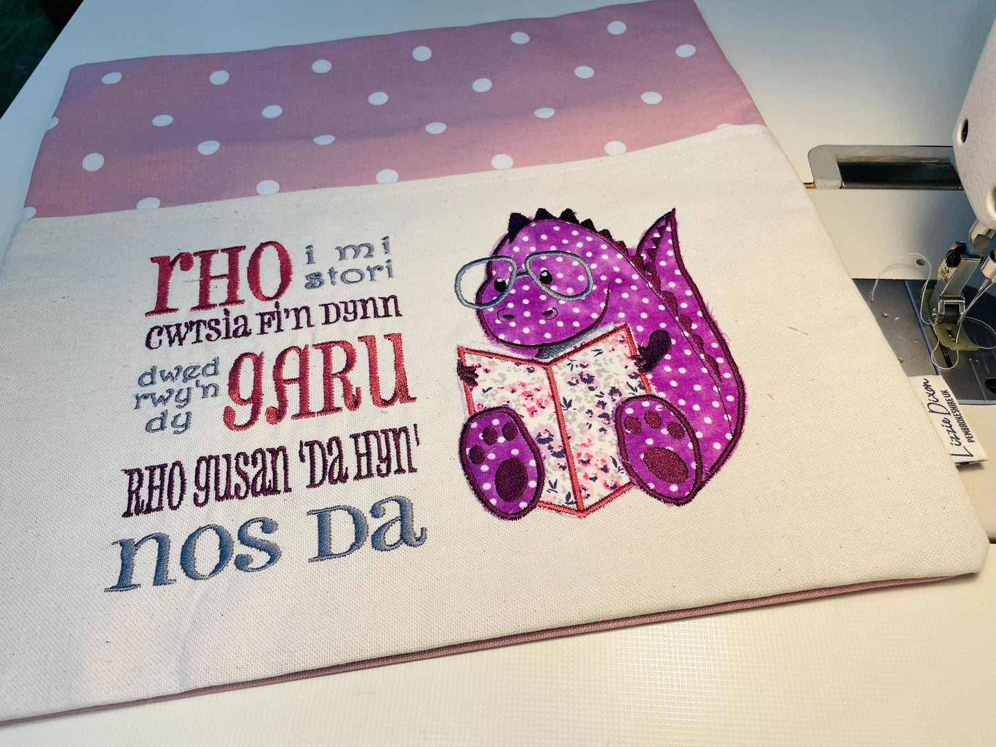 Cute dinosaur Children's Book Cushion available in Welsh and English