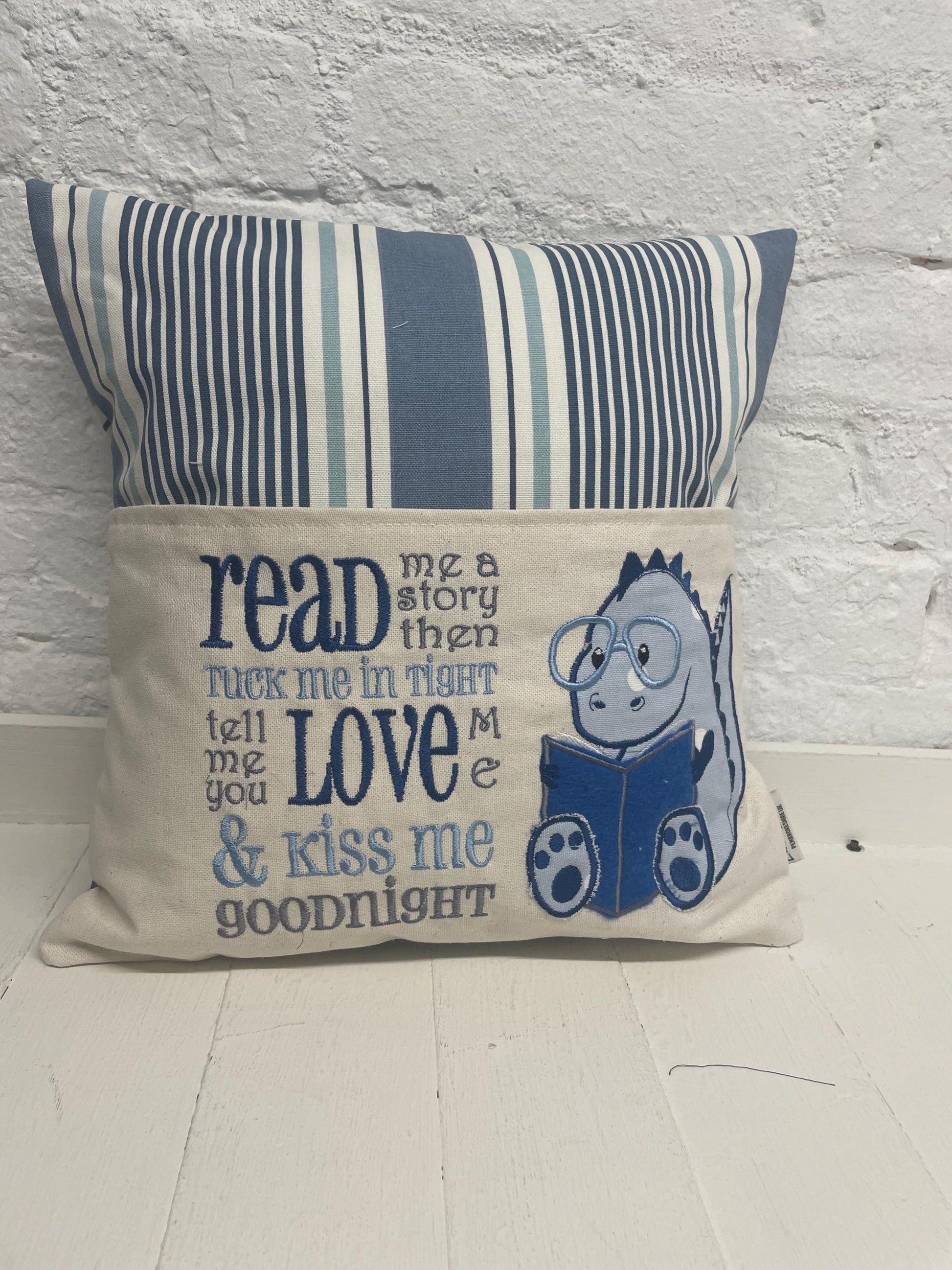 Cute dinosaur Children's Book Cushion available in Welsh and English