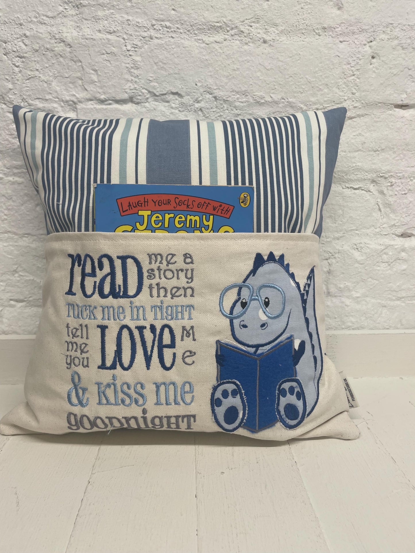 Cute dinosaur Children's Book Cushion available in Welsh and English