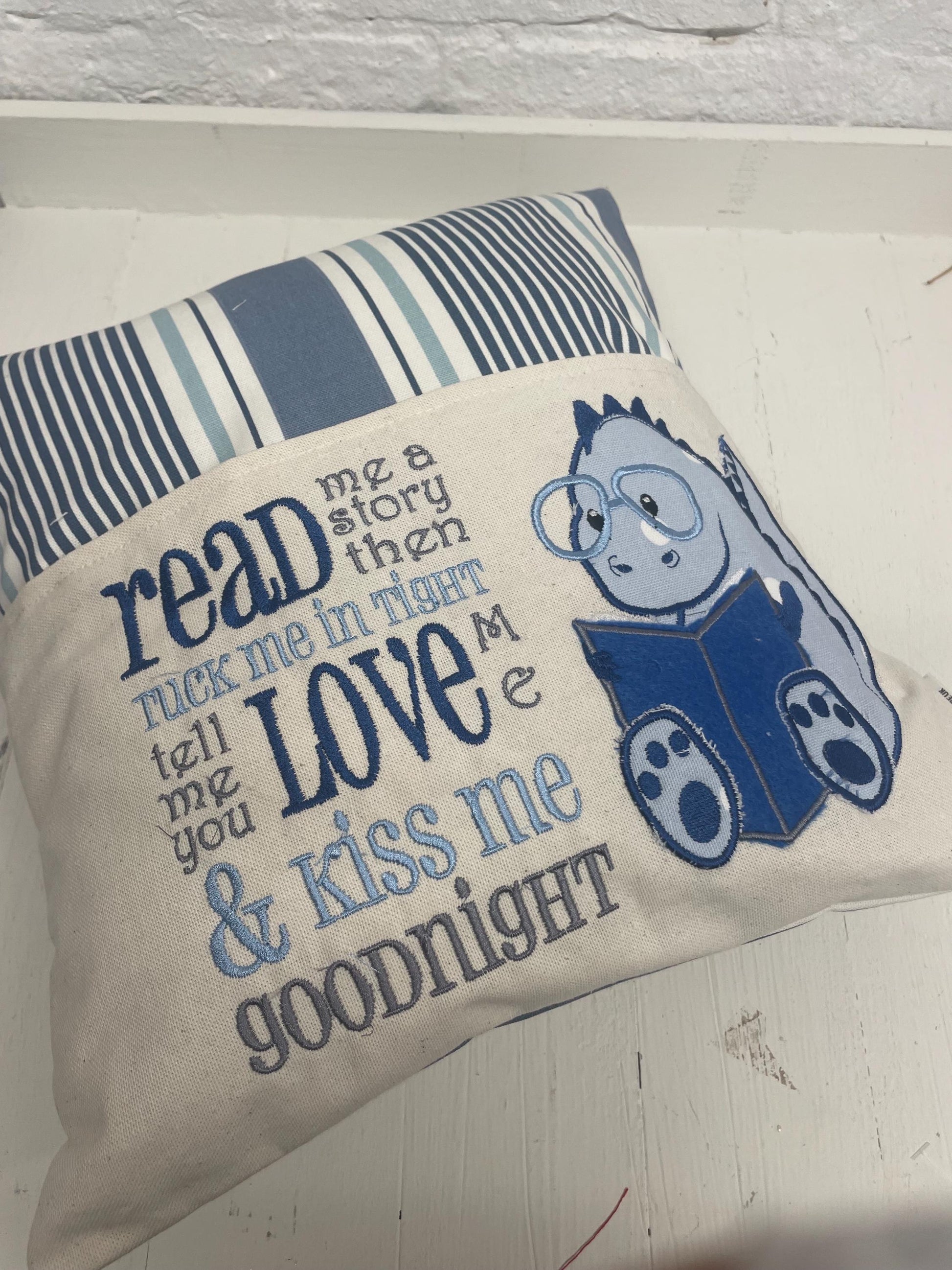 Cute dinosaur Children's Book Cushion available in Welsh and English