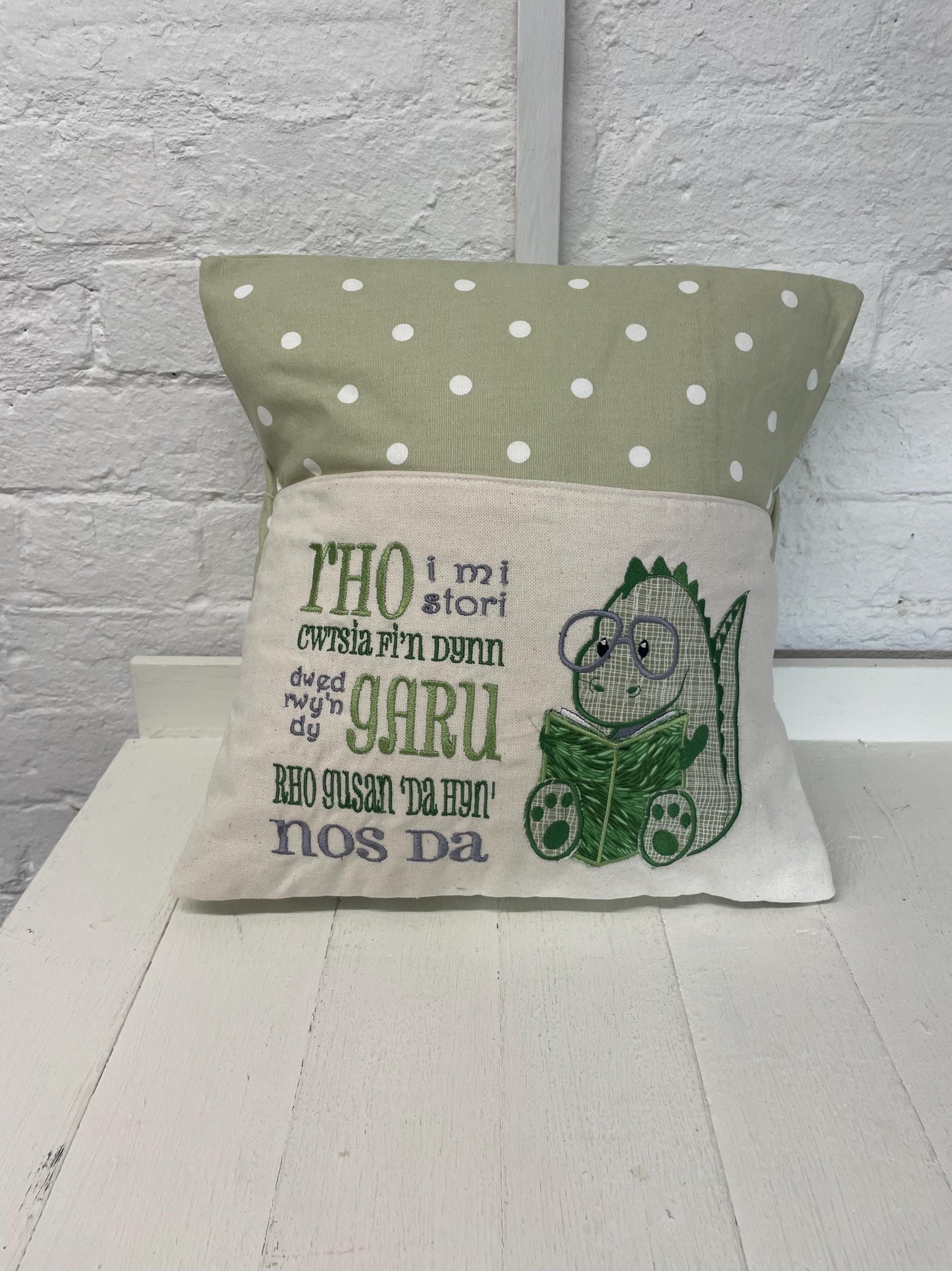 Cute dinosaur Children's Book Cushion available in Welsh and English