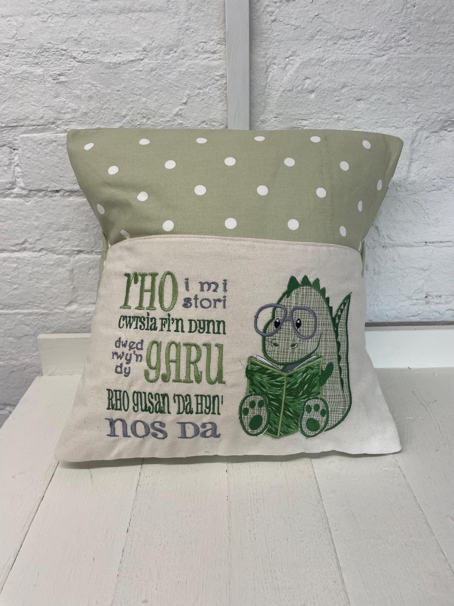 Cute dinosaur Children's Book Cushion available in Welsh and English