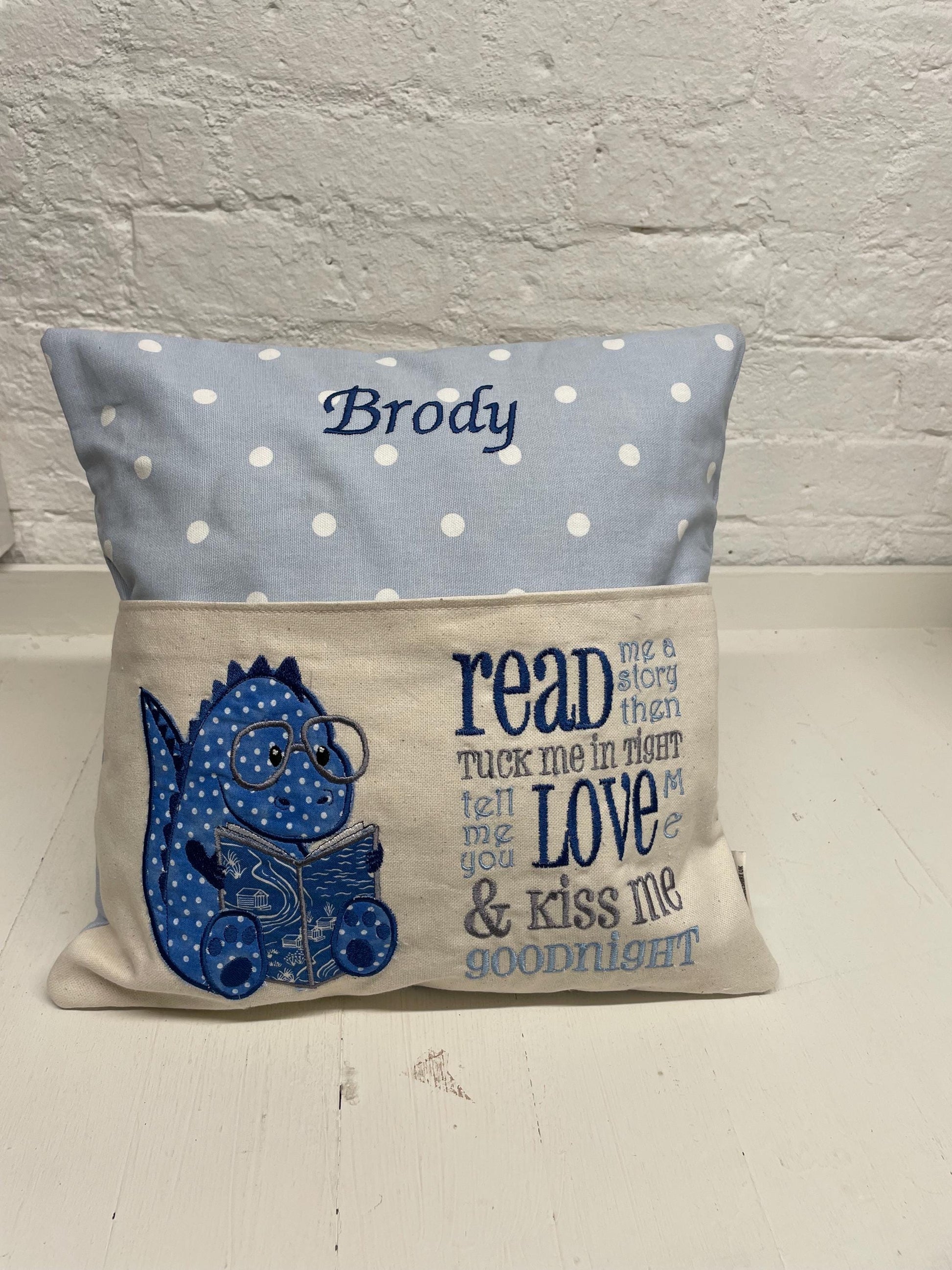 Cute dinosaur Children's Book Cushion available in Welsh and English