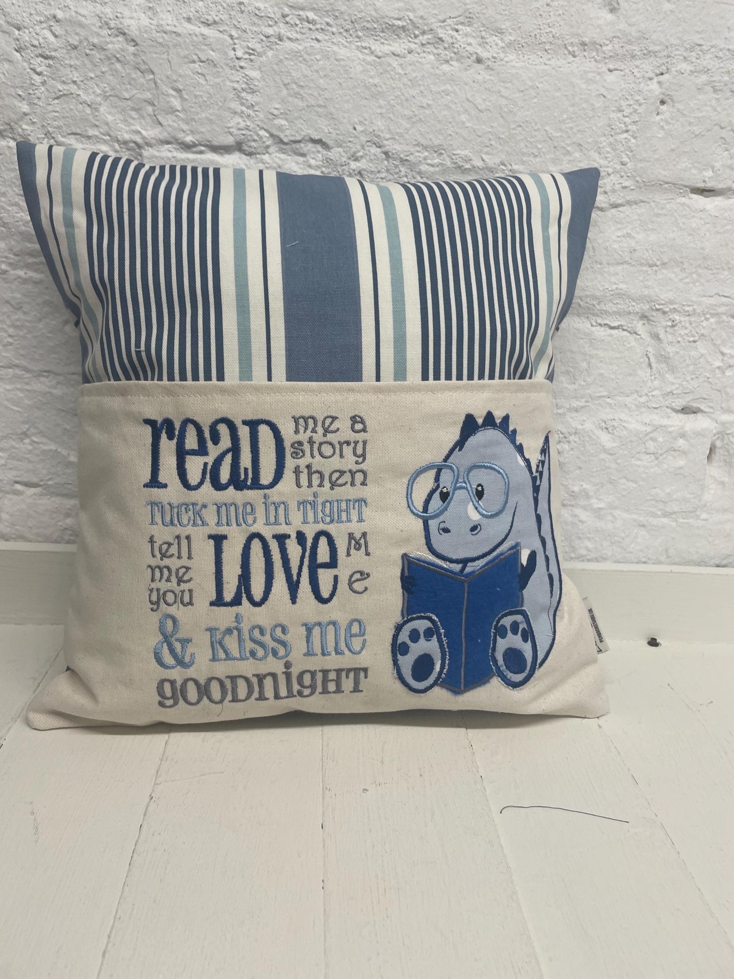 Cute dinosaur Children's Book Cushion available in Welsh and English