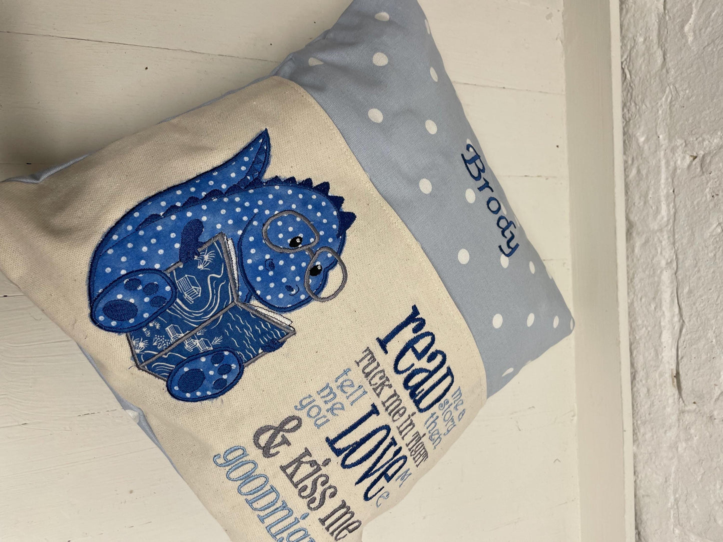 Cute dinosaur Children's Book Cushion available in Welsh and English