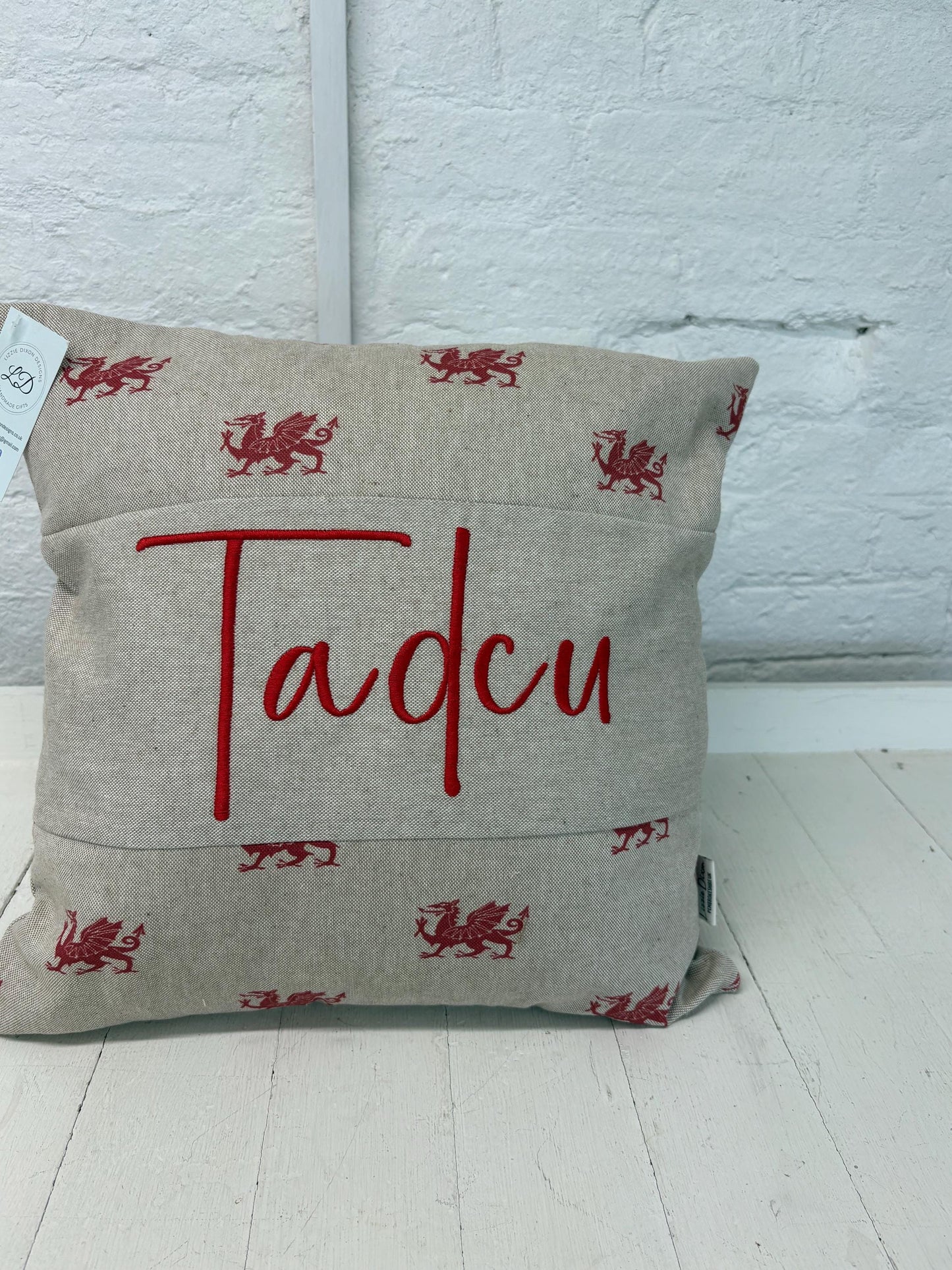 welsh dragon cushion with Tadcu embroidered on it
