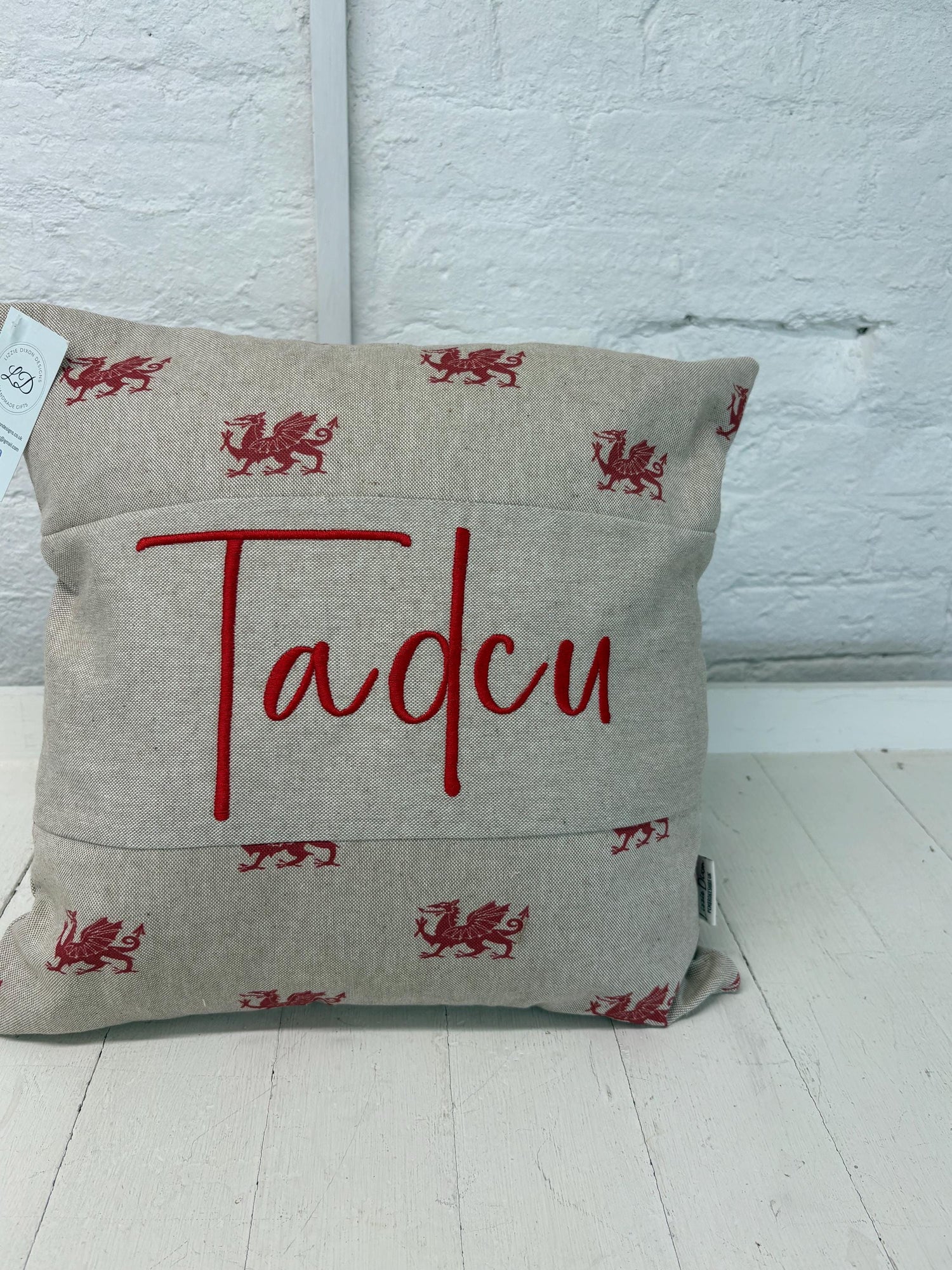 welsh dragon cushion with Tadcu embroidered on it