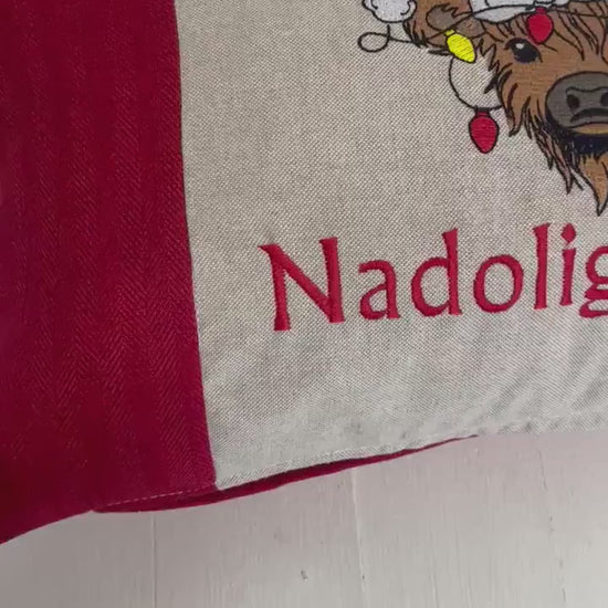 Festive Highland Cow with slights  - Nadolig Llawen-Merry Christmas. Red Tweed Fabric