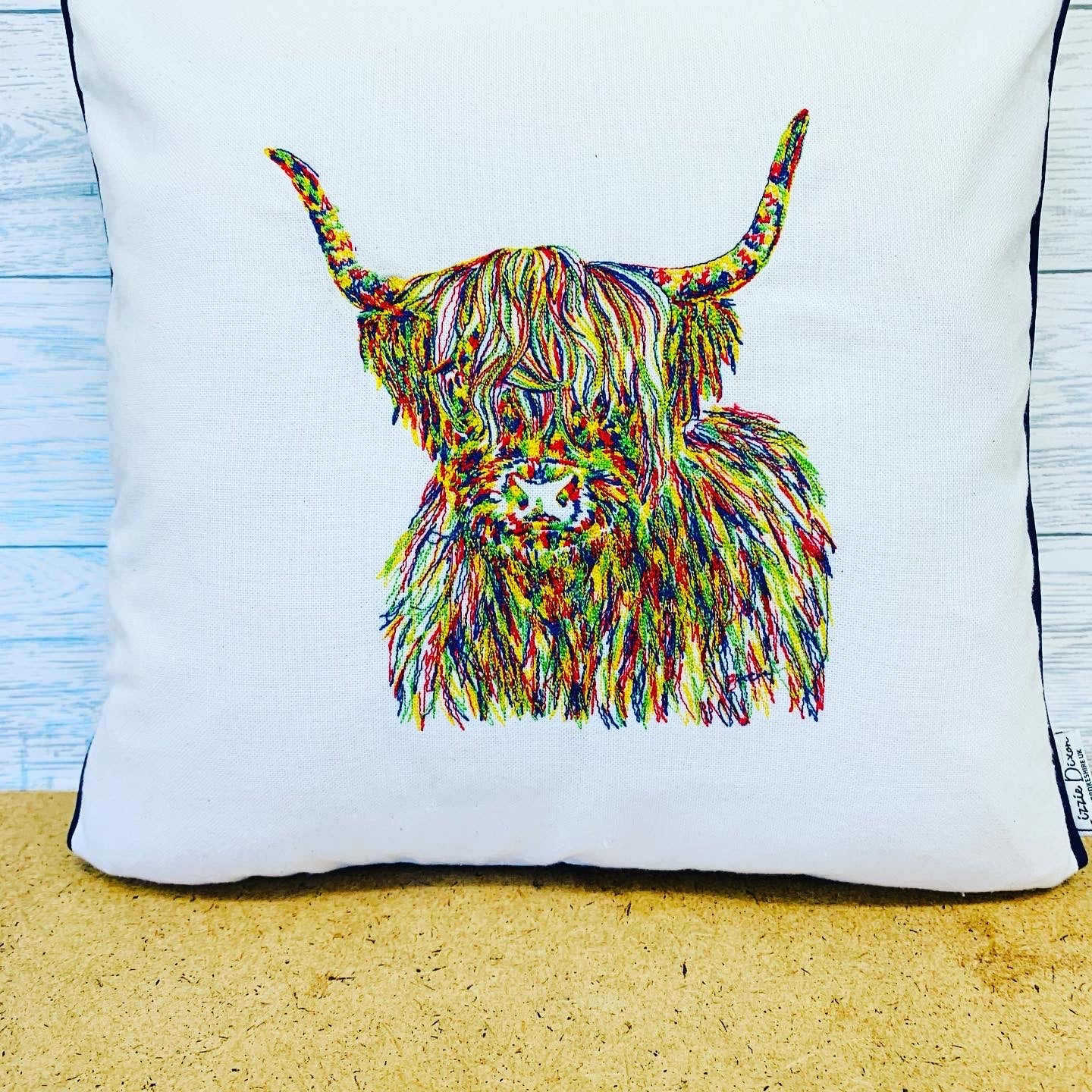 Multi Coloured Highland Cow Cushion, Cream/Taupe Piped Embroidered Cushion - Lizzie Dixon Designs