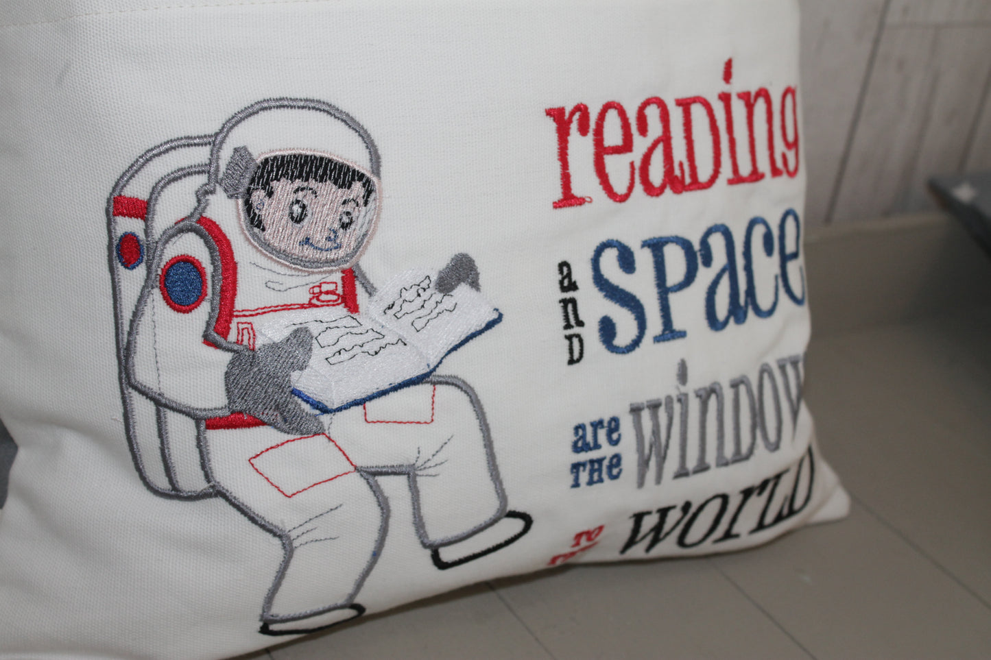 Space man Reading in space Children's Reading Book Cushion - Lizzie Dixon Designs