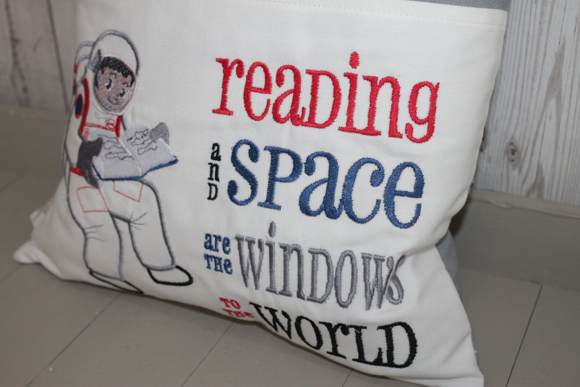 Space man Reading in space Children's Reading Book Cushion - Lizzie Dixon Designs