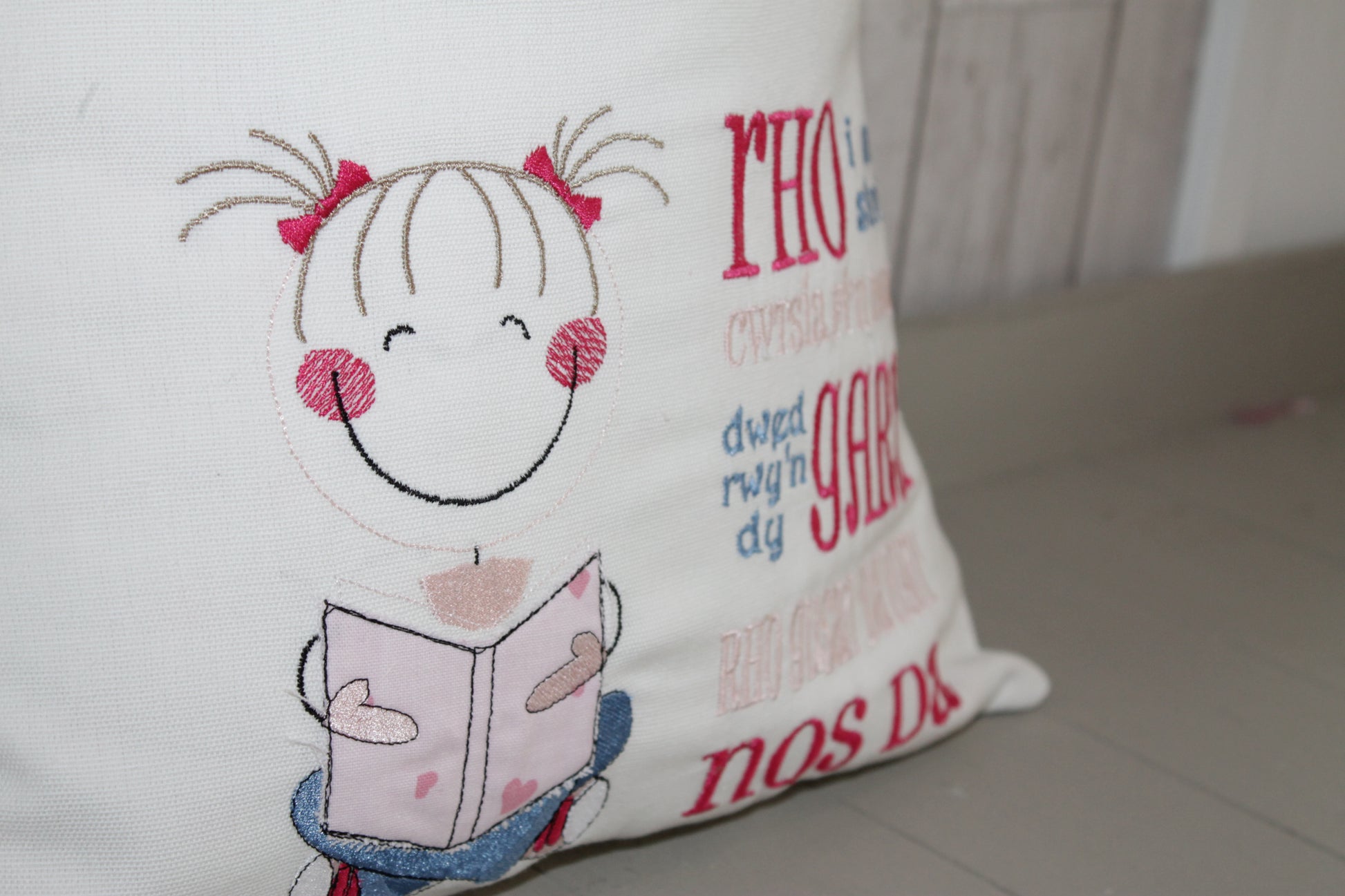 Cute Little Girl and Pink Dotty-Children's Reading Book Cushion Welsh saying - Lizzie Dixon Designs