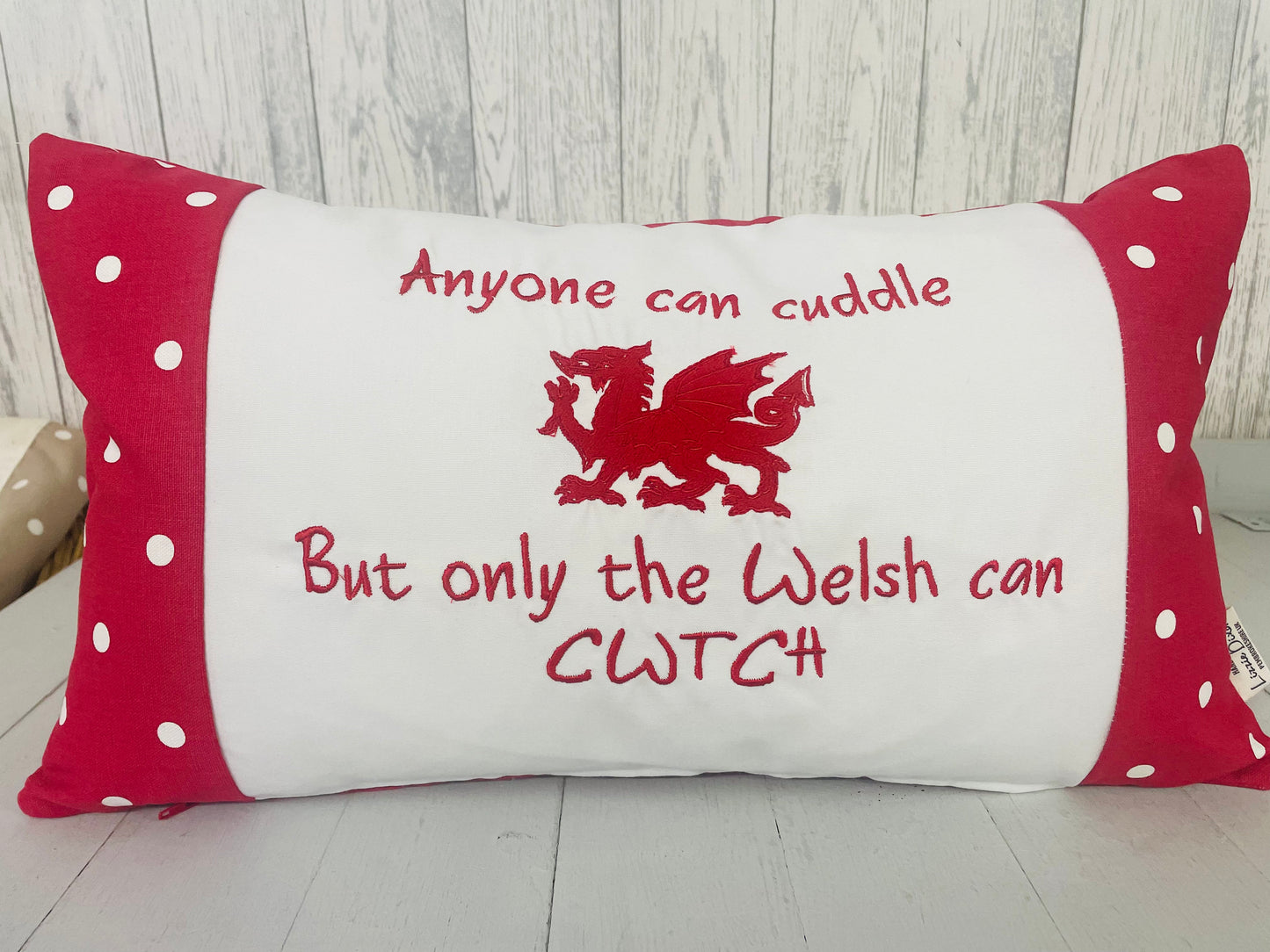 Red Dotty anyone can cuddle long Panel cushion -Welsh quote cushion